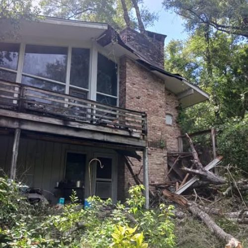 Fairhope, AL, - emergency job - removing an uprooted water oak from a home